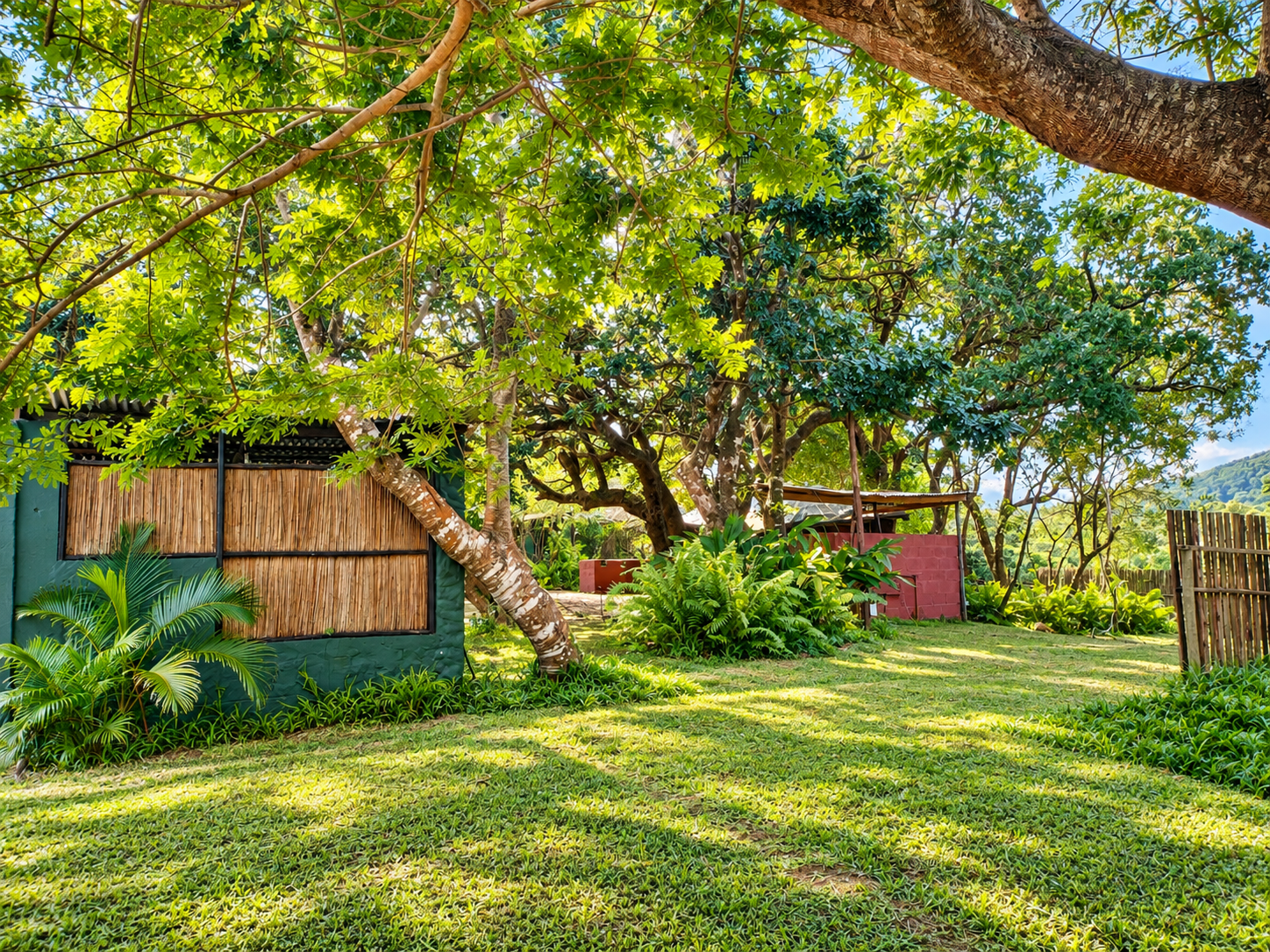 Green shaded garden area within the Gala-Gala Camping Extension